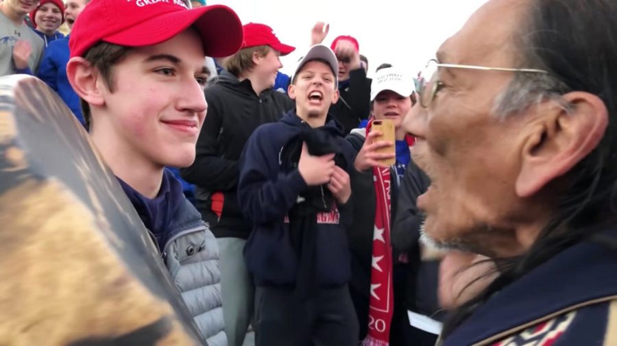 A+video+of+Covington+Catholic+High+School+student+Nick+Sandmann%2C+left%2C+and+Native+American+activist+Nathan+Phillips+went+viral+after+their+encounter+in+Washington%2C+D.C.%2C+on+Jan.+18%2C+2019.+Screenshot+via+YouTube