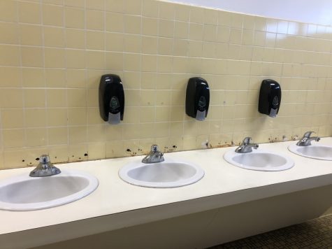 These sinks in the girls bathroom are missing tiling because the tiling rotted and had to be ripped out.